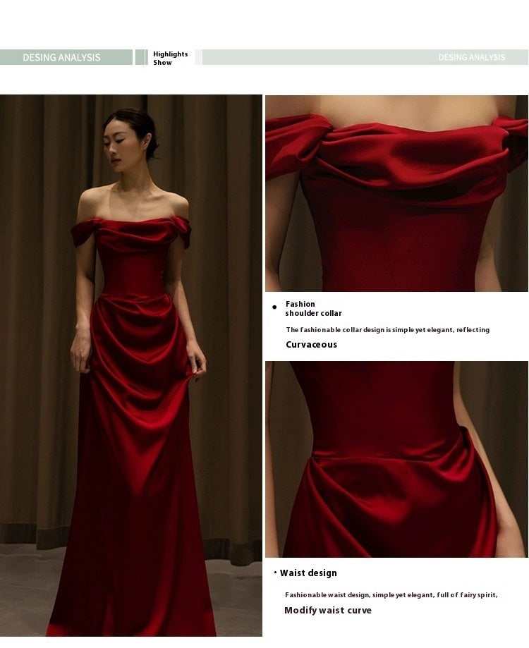 Red evening gown with detailed design elements on a model against a plain background.